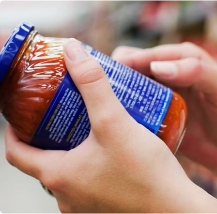 Reading a jar label.