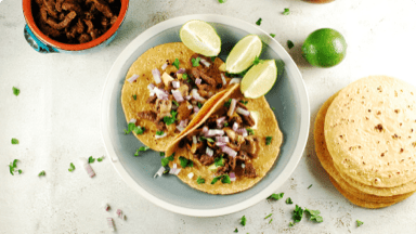 Mushroom and beef tacos in tortillas served family style for dinner. Mushroom and beef tacos in tortillas served family style for dinner.