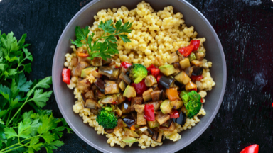 Mediterranean salad with couscous and roasted vegetables in a bowl. Mediterranean salad with couscous and roasted vegetables in a bowl.