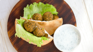 Crispy falafel in a pita ready to be eaten. Crispy falafel in a pita ready to be eaten.