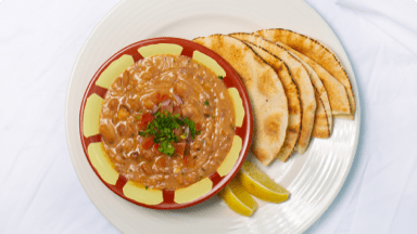Egyptian fava bean foule served and ready to be eaten. Egyptian fava bean foule served and ready to be eaten.