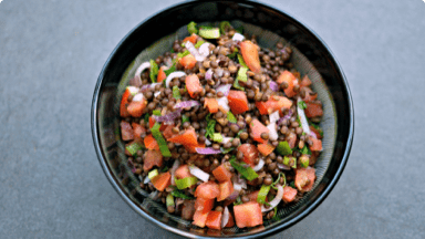 Hearty lentil salad with tomatoes and peppers in a bowl. Hearty lentil salad with tomatoes and peppers in a bowl.