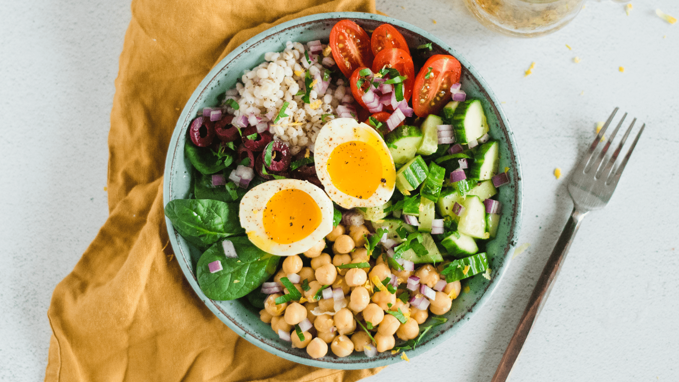 Colourful Mediterranean-inspired salad in a bowl ready to be eaten.