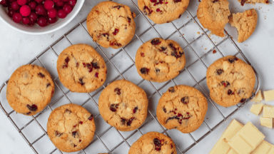Oatmeal chocolate cranberry cookies cooling on a wire rack. Oatmeal chocolate cranberry cookies cooling on a wire rack.