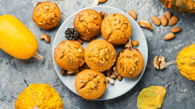 Pumpkin muffins on plate ready to be eaten as a Fall snack. Pumpkin muffins on plate ready to be eaten as a Fall snack.