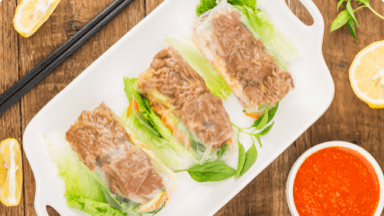 Thai beef salad rolls on a plate ready to be eaten. Thai beef salad rolls on a plate ready to be eaten.
