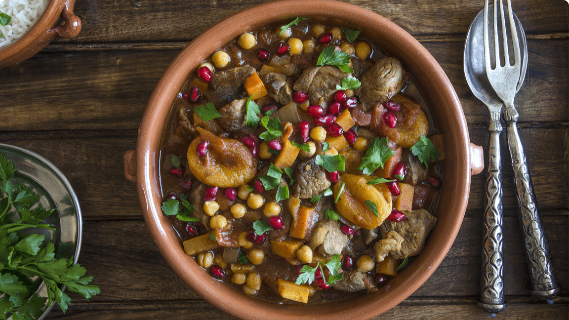 Cooked beef and apricots in a heart stew ready to be served for dinner. Cooked beef and apricots in a heart stew ready to be served for dinner.