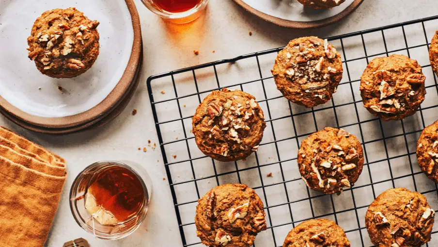 Sweet potato and chai spice muffins cooling on a wire rack ready to be eaten. Sweet potato and chai spice muffins cooling on a wire rack ready to be eaten.